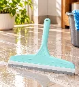 Mint Squeegee on Sunlit Wet Tiles.webp